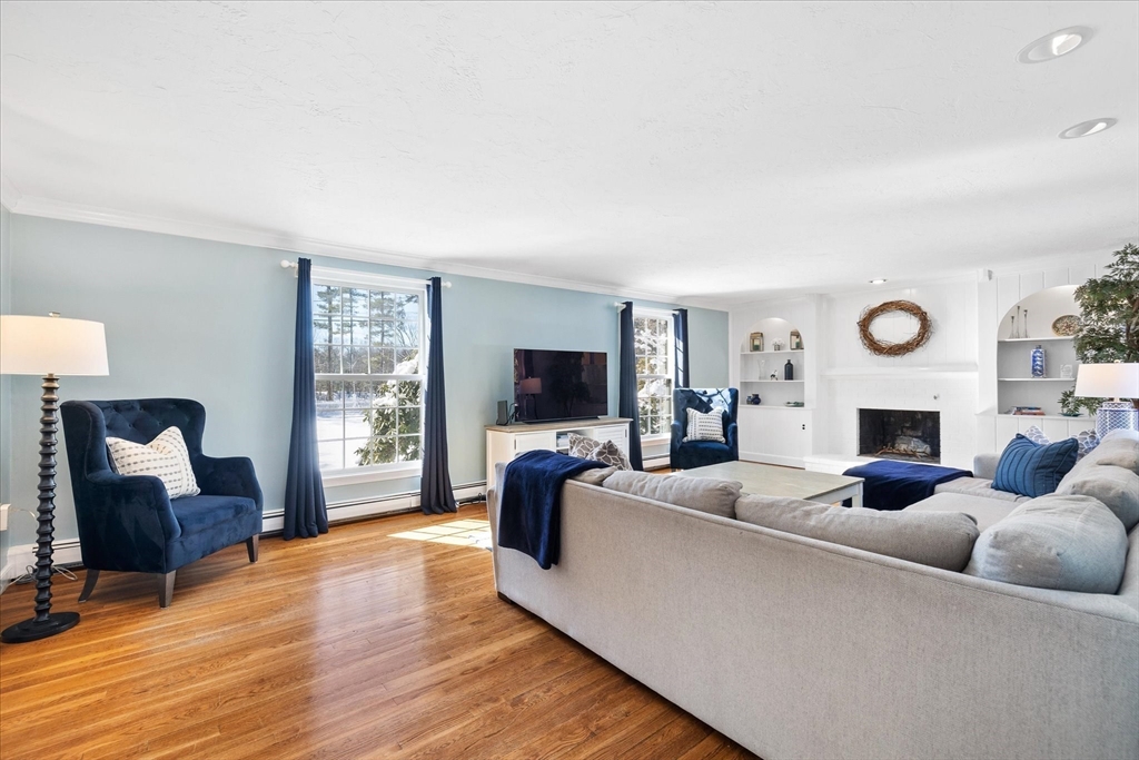 10 Spring Road Westborough, MA 01581 - Photo 5 of 42 a living room with fireplace furniture and a flat screen tv