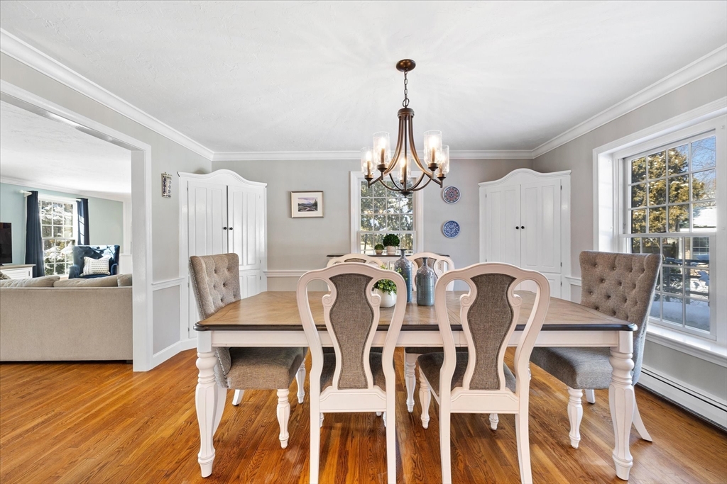 10 Spring Road Westborough, MA 01581 - Photo 7 of 42 a view of a dining room with furniture wooden floor and chandelier