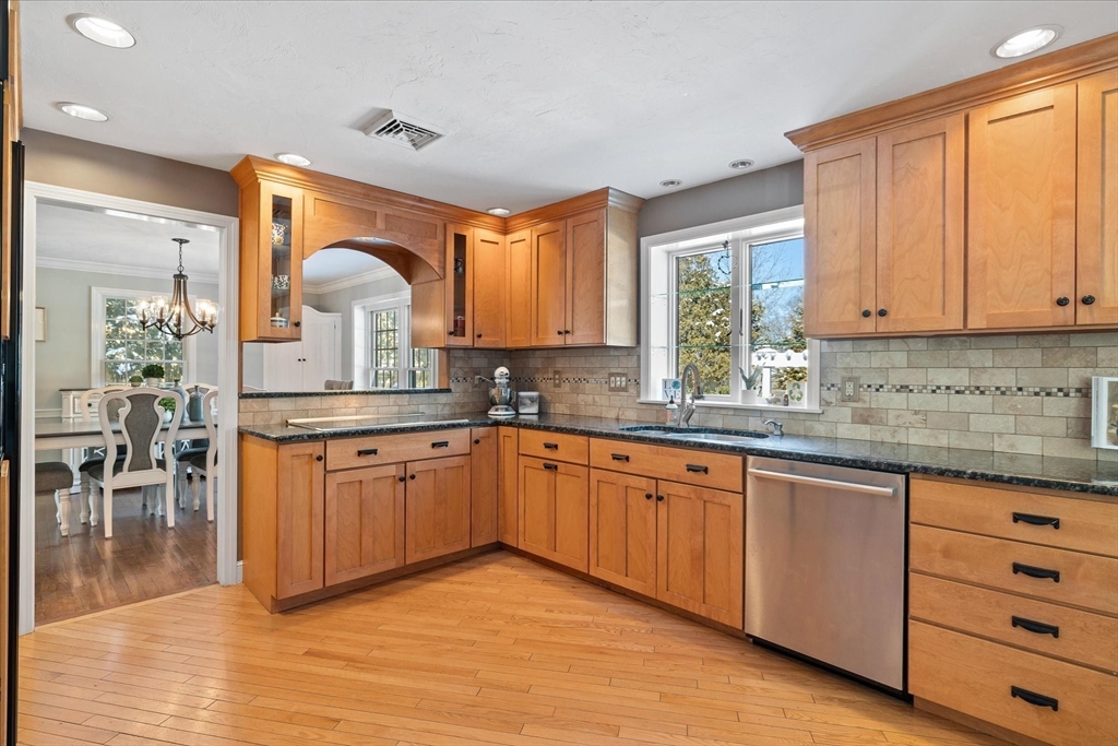 10 Spring Road Westborough, MA 01581 - Photo 9 of 42 a kitchen with stainless steel appliances granite countertop a sink and cabinets