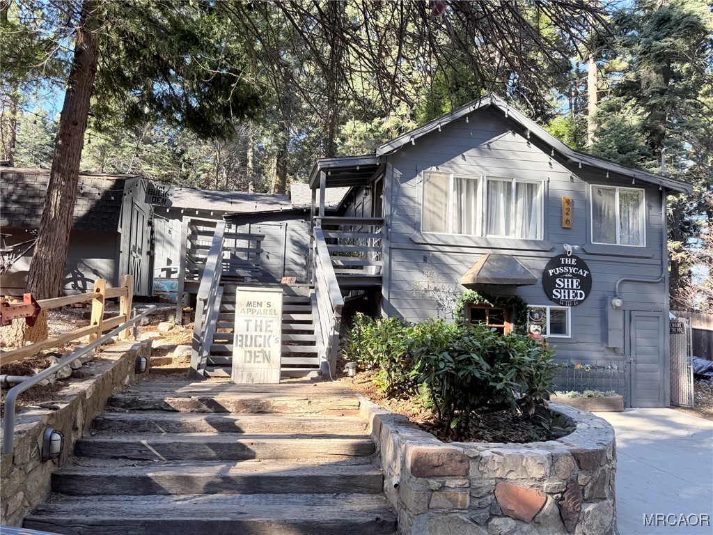 926 Kuffle Canyon Road Skyforest, CA 92385 - Photo 2 of 35 a front view of a house with a yard