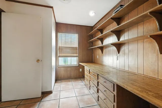 a kitchen with a cabinets and window