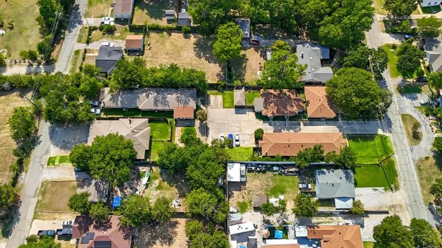an aerial view of a house with a lake view