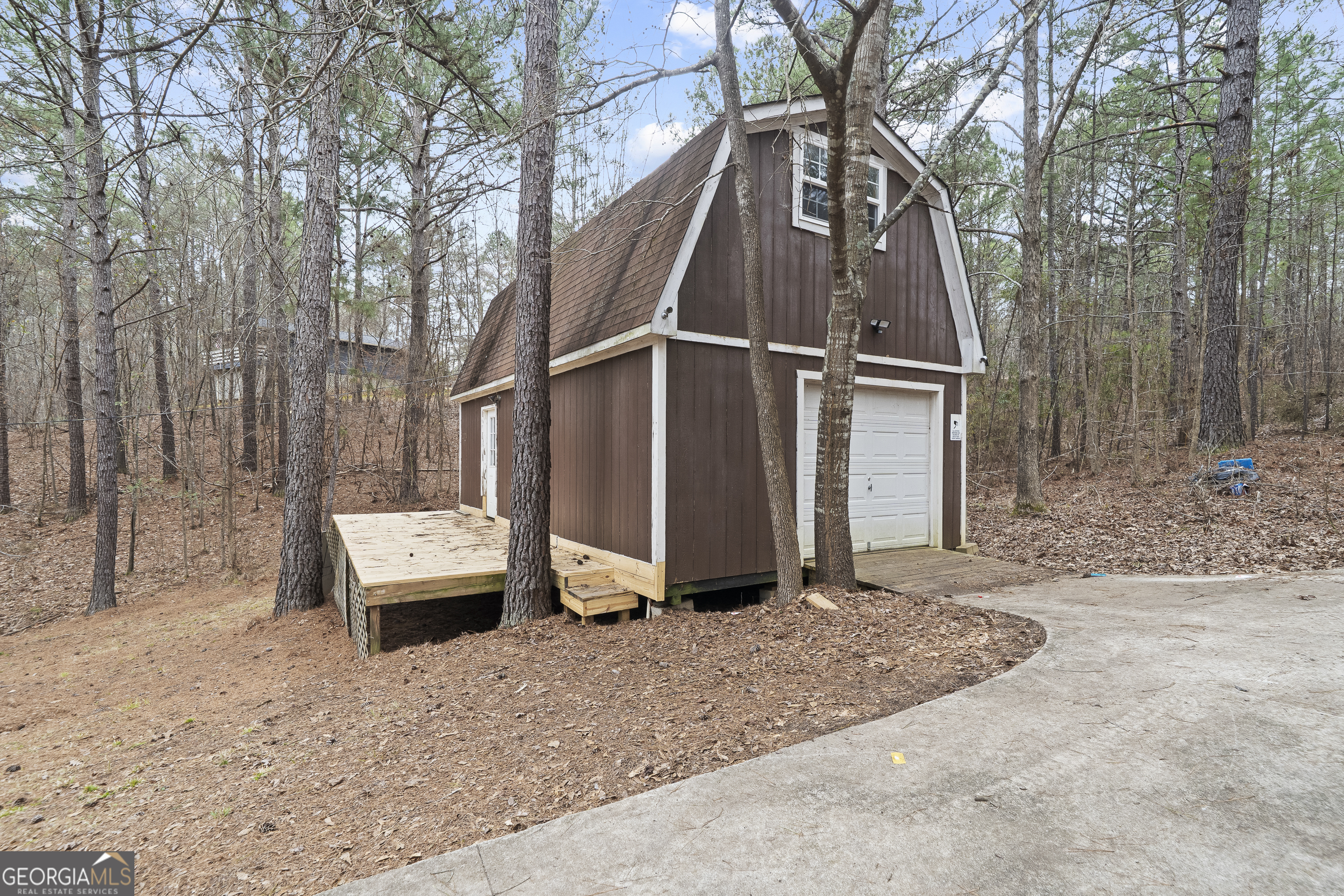 1011 Sandy Run Drive Sparta, GA 31087 - Photo 25 of 39 a view of backyard with large trees and wooden fence