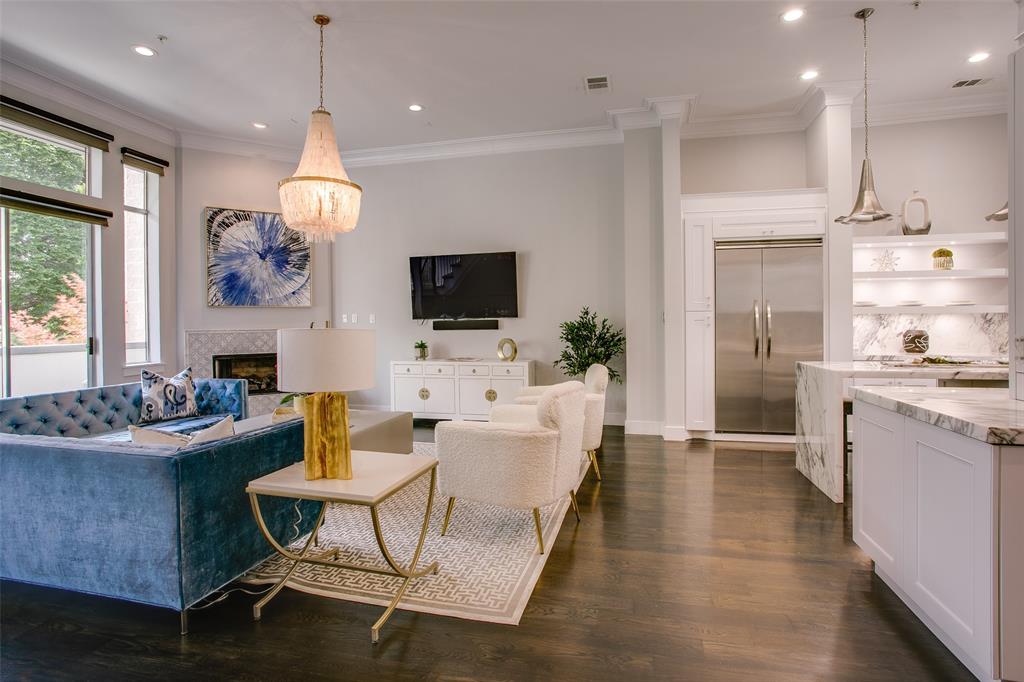 2211 Worthington Street Dallas, TX 75204 - Photo 11 of 36 a living room with fireplace furniture and a flat screen tv