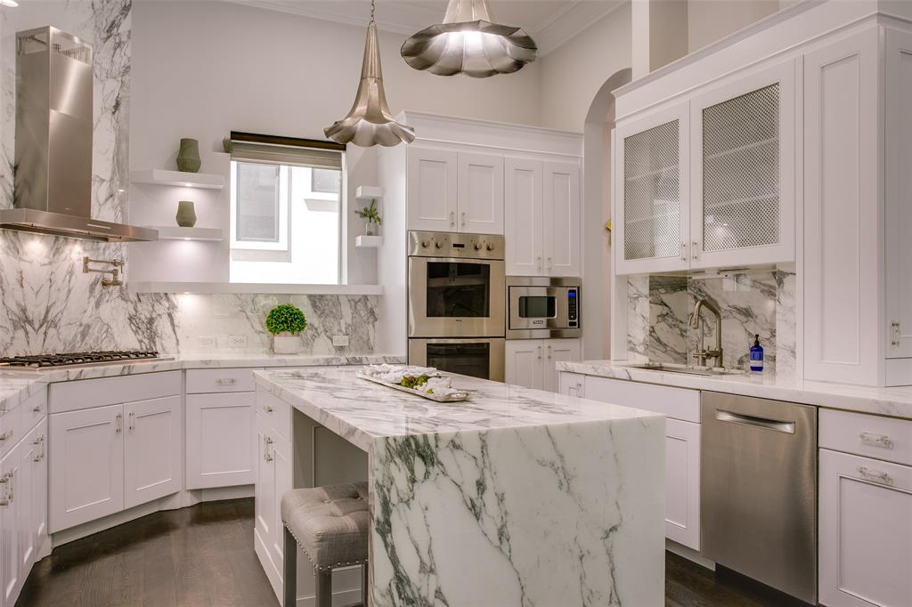 2211 Worthington Street Dallas, TX 75204 - Photo 15 of 36 a kitchen with a table chairs sink and cabinets