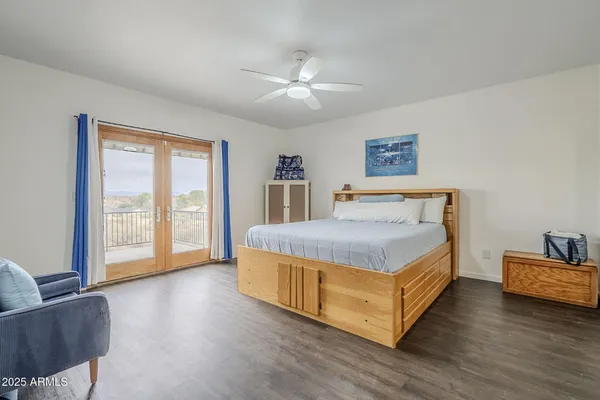 a spacious bedroom with a bed and a couch