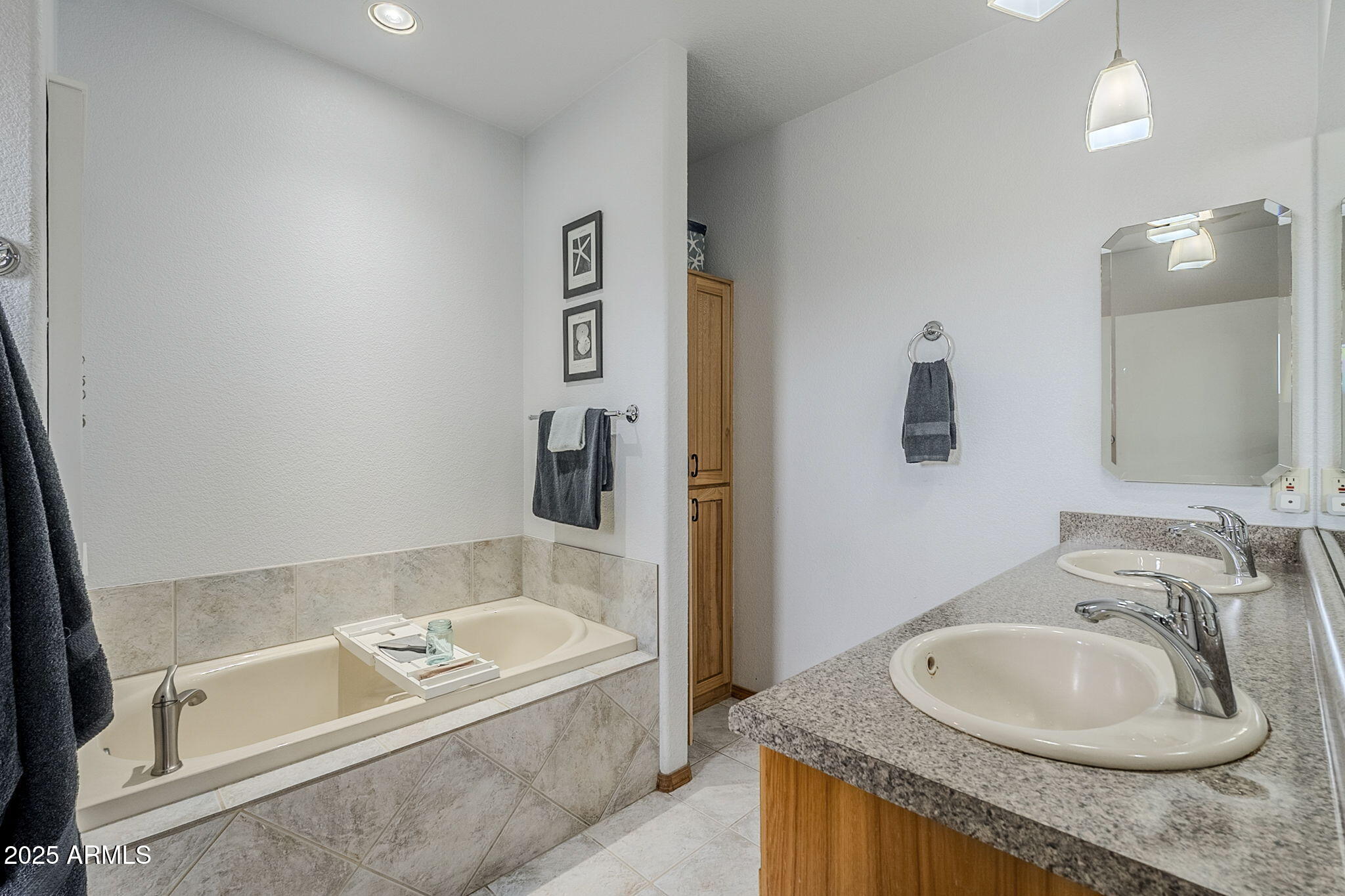 17862 East Hummingbird Lane Mayer, AZ 86333 - Photo 13 of 46 a bathroom with a granite countertop tub sink and mirror
