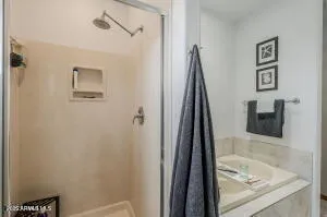 a bathroom with a tub and a sink