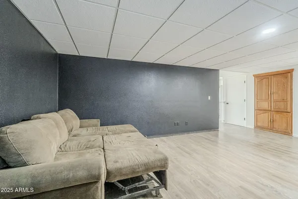 a bedroom with a bed and a couch