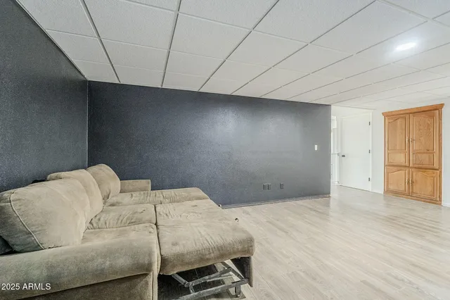 a bedroom with a bed and a couch