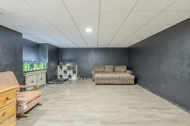 a bedroom with furniture and a chair