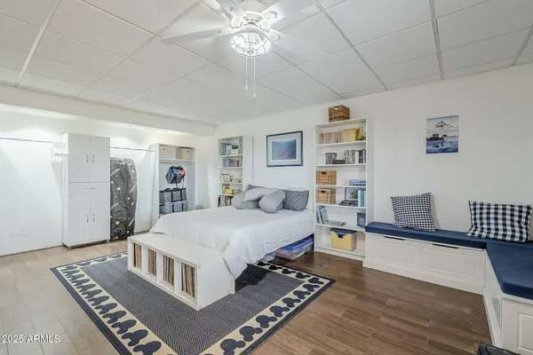 a living room with hard wood flooring and a couch