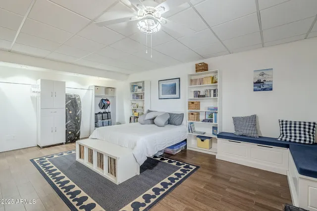 a living room with hard wood flooring and a couch