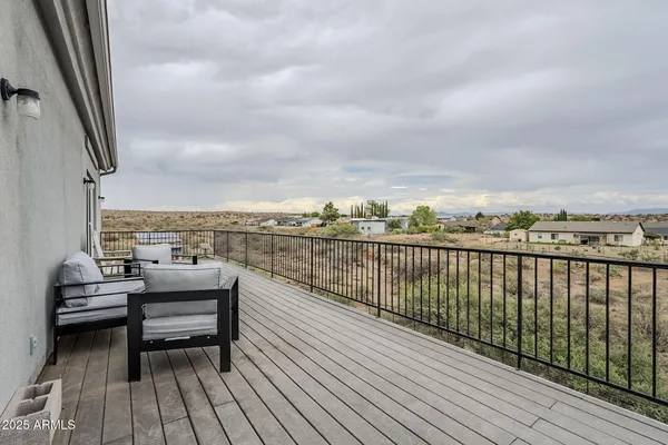 a view of roof deck with patio
