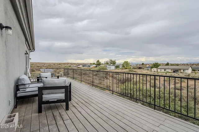 a view of roof deck with patio