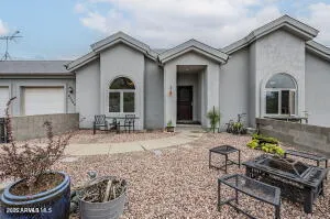 a front view of a house with seating space