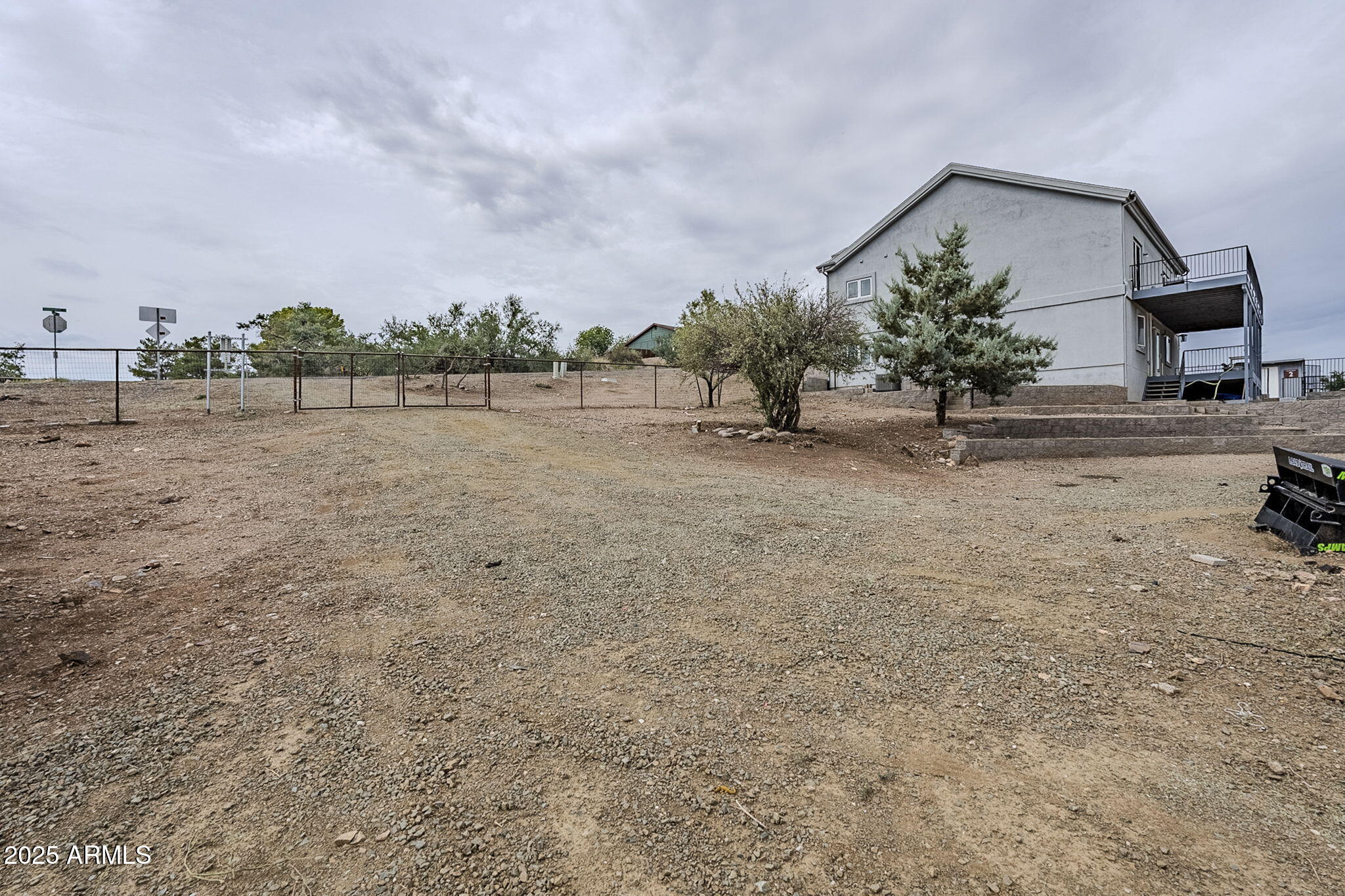 17862 East Hummingbird Lane Mayer, AZ 86333 - Photo 40 of 46 a view of a dry yard with wooden fence