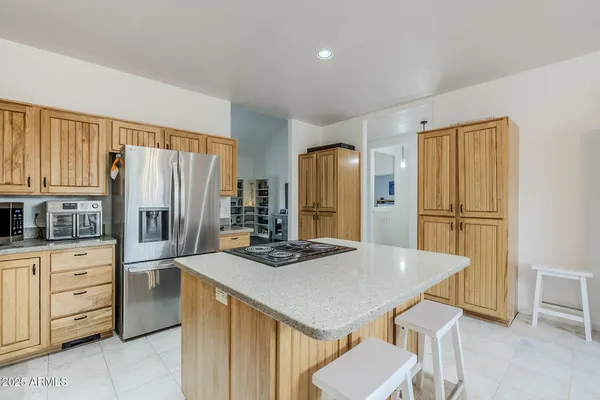 a kitchen with stainless steel appliances a refrigerator and a stove