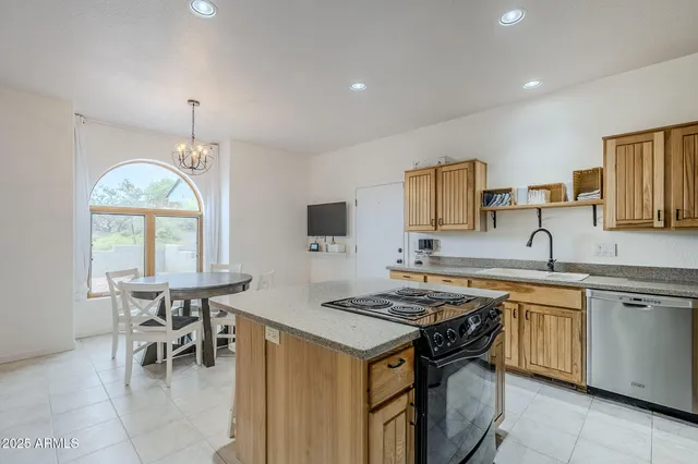a kitchen that has a table and chairs in it