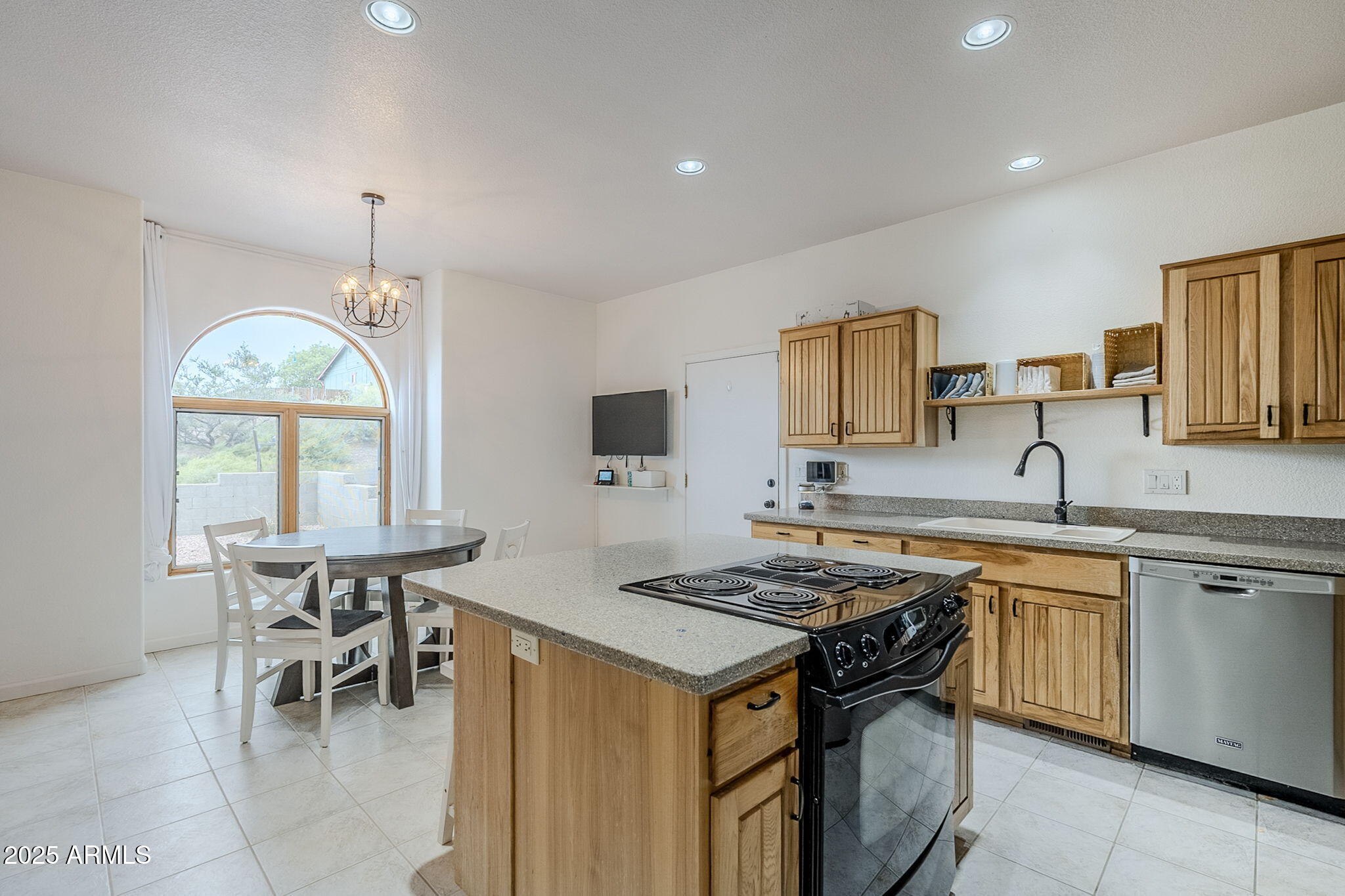 17862 East Hummingbird Lane Mayer, AZ 86333 - Photo 6 of 46 a kitchen that has a table and chairs in it