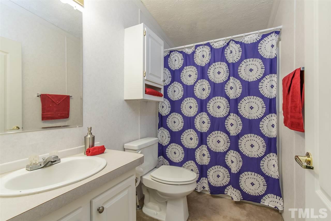 4959 Thom Road Mebane, NC 27302 - Photo 14 of 30 Full bath between laundry and Bedrooms 2 & 3