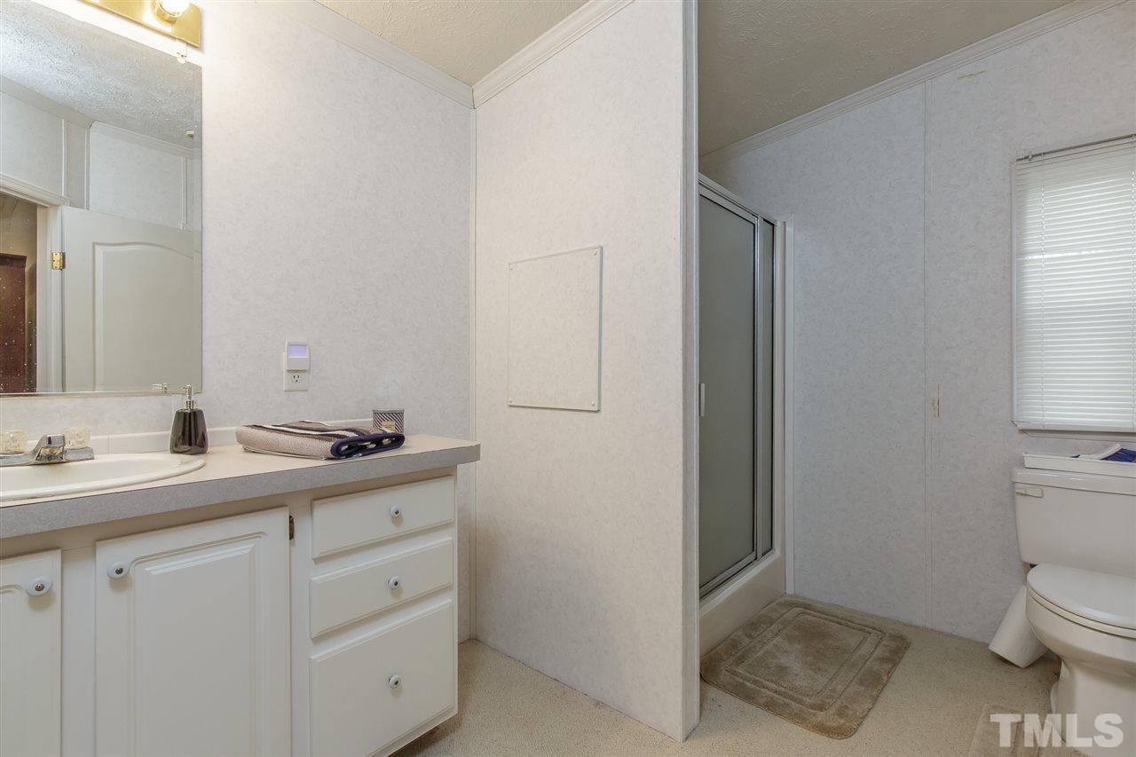 4959 Thom Road Mebane, NC 27302 - Photo 18 of 30 Master bath 2 offers extended vanity, walk-in shower and water closet