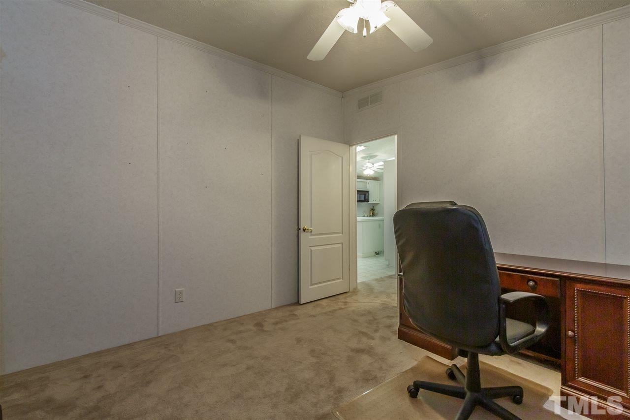 4959 Thom Road Mebane, NC 27302 - Photo 20 of 30 Currently used as an office with carpet and fan