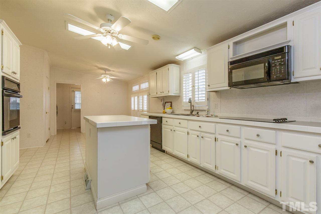 4959 Thom Road Mebane, NC 27302 - Photo 8 of 30 Crisp white kitchen with center island