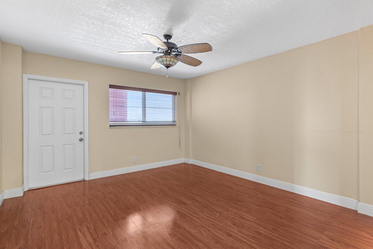 1040 Banyan Road, Unit 501C Boca Raton, FL 33432 - Photo 26 of 47 a view of a big room with wooden floor and windows in a room