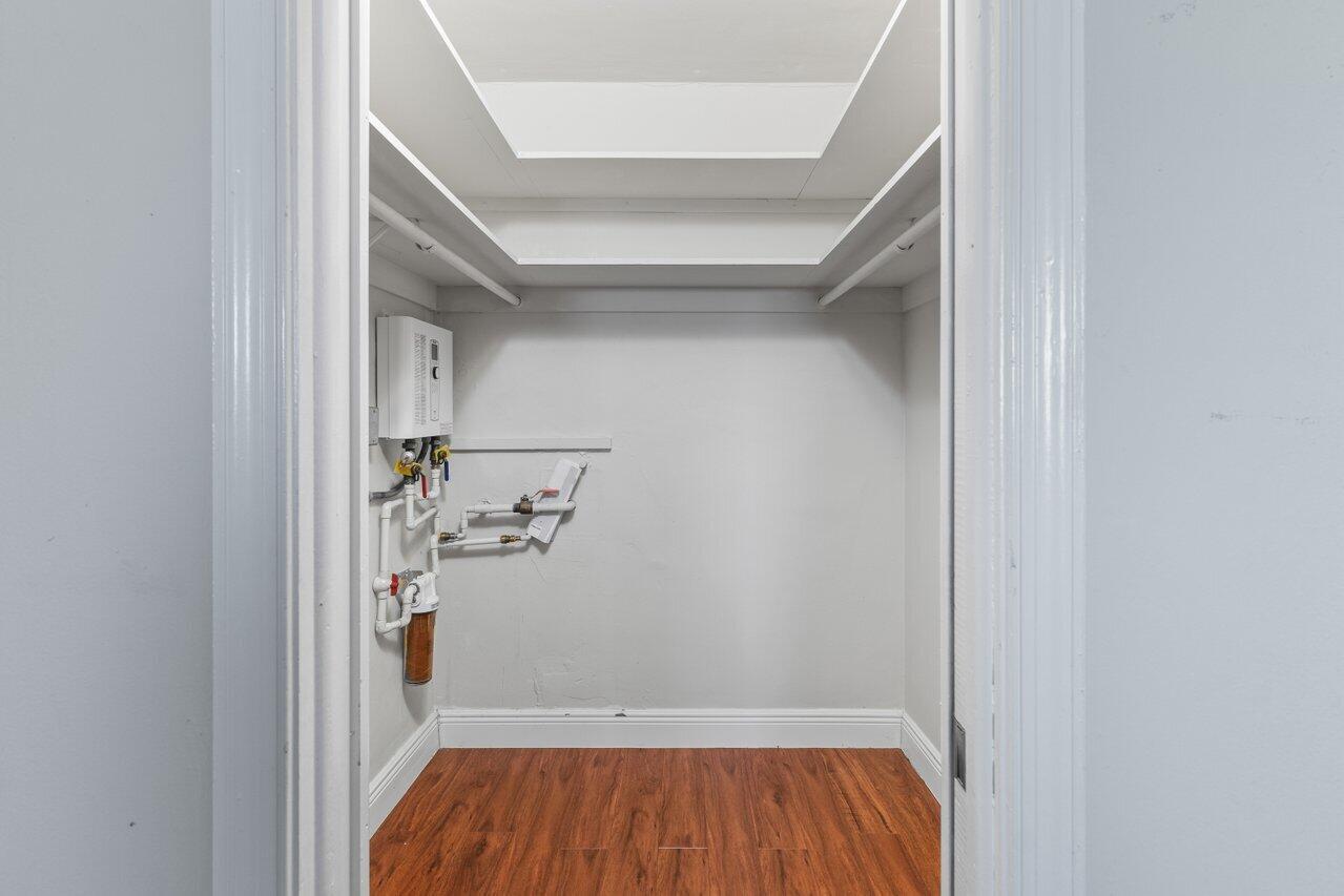 1040 Banyan Road, Unit 501C Boca Raton, FL 33432 - Photo 27 of 47 a view of storage and utility room with wooden floor