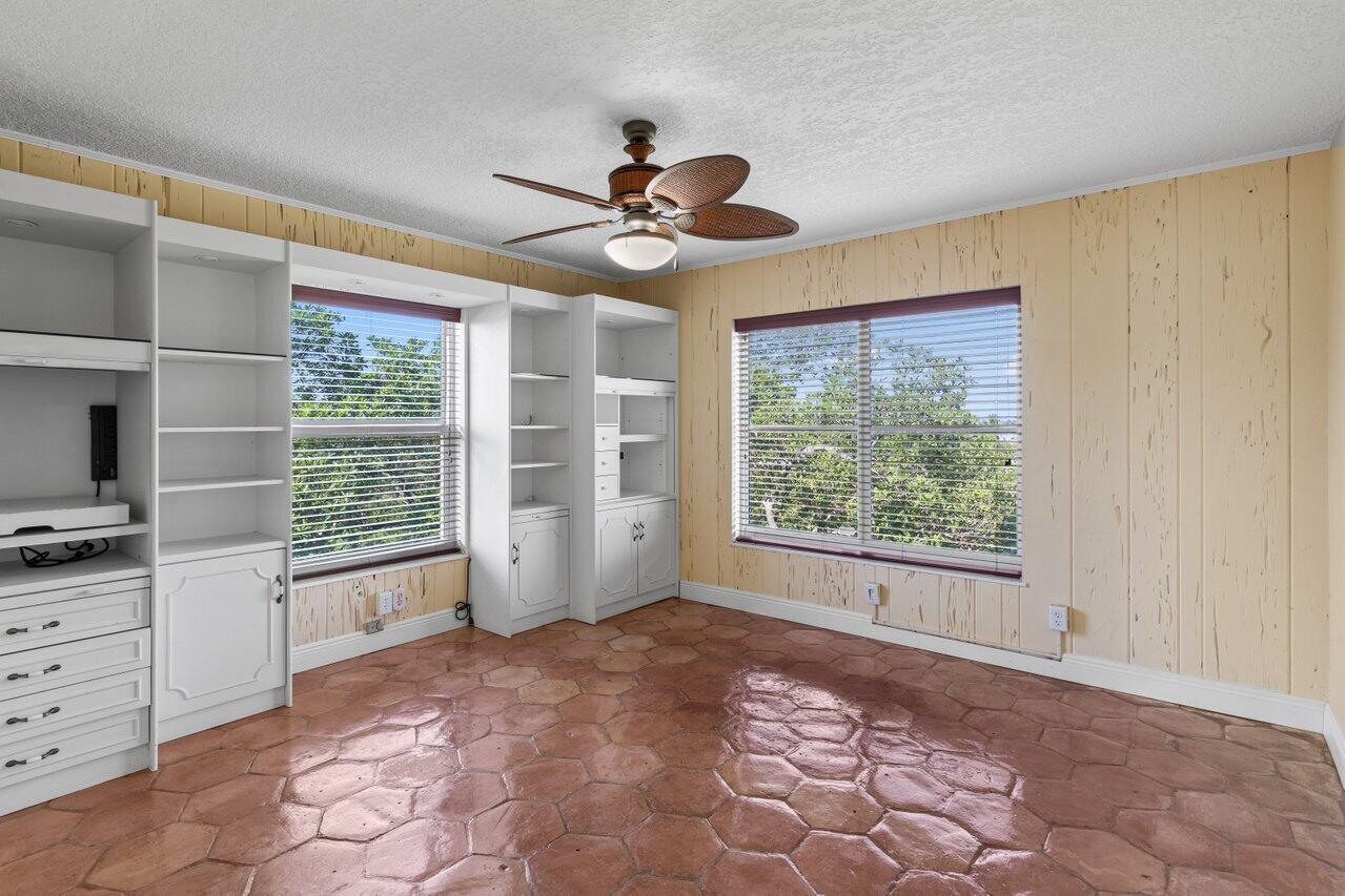 1040 Banyan Road, Unit 501C Boca Raton, FL 33432 - Photo 29 of 47 a view of a livingroom with a ceiling fan and window