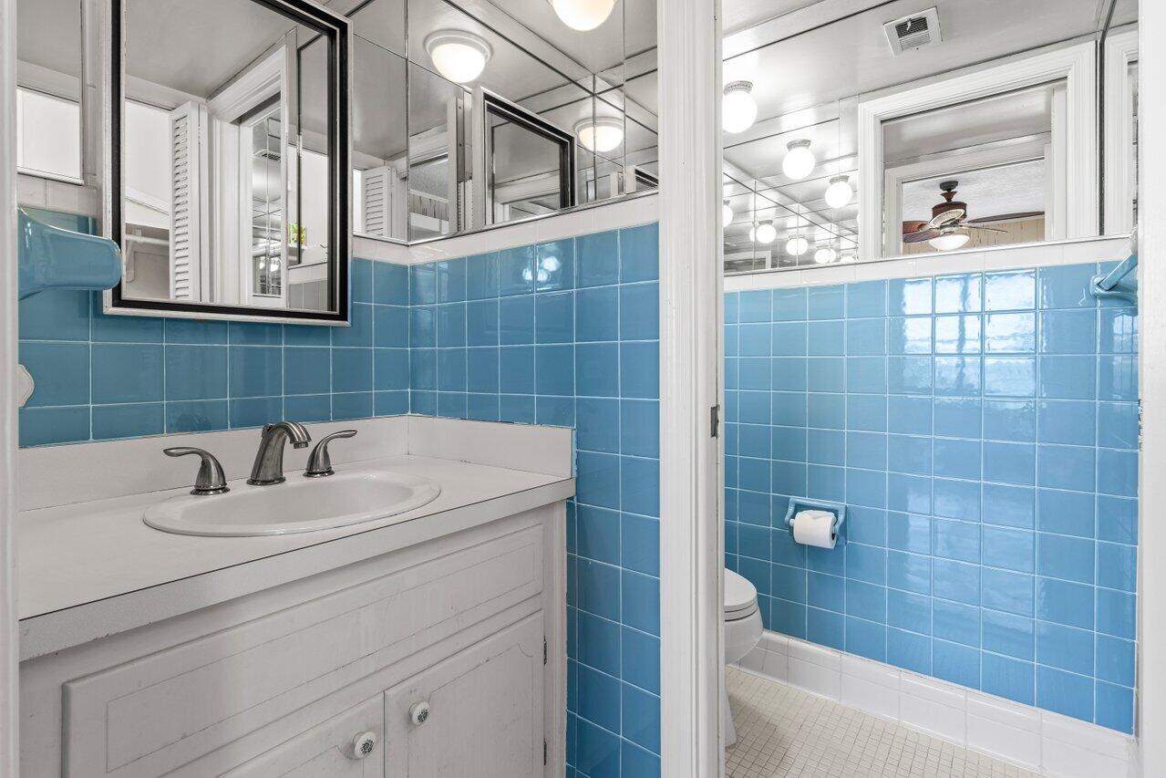 1040 Banyan Road, Unit 501C Boca Raton, FL 33432 - Photo 30 of 47 a bathroom with a sink a toilet and shower