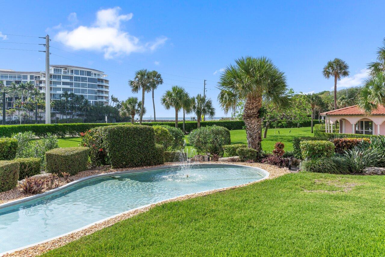 1040 Banyan Road, Unit 501C Boca Raton, FL 33432 - Photo 36 of 47 a view of a patio with table and chairs and potted plants