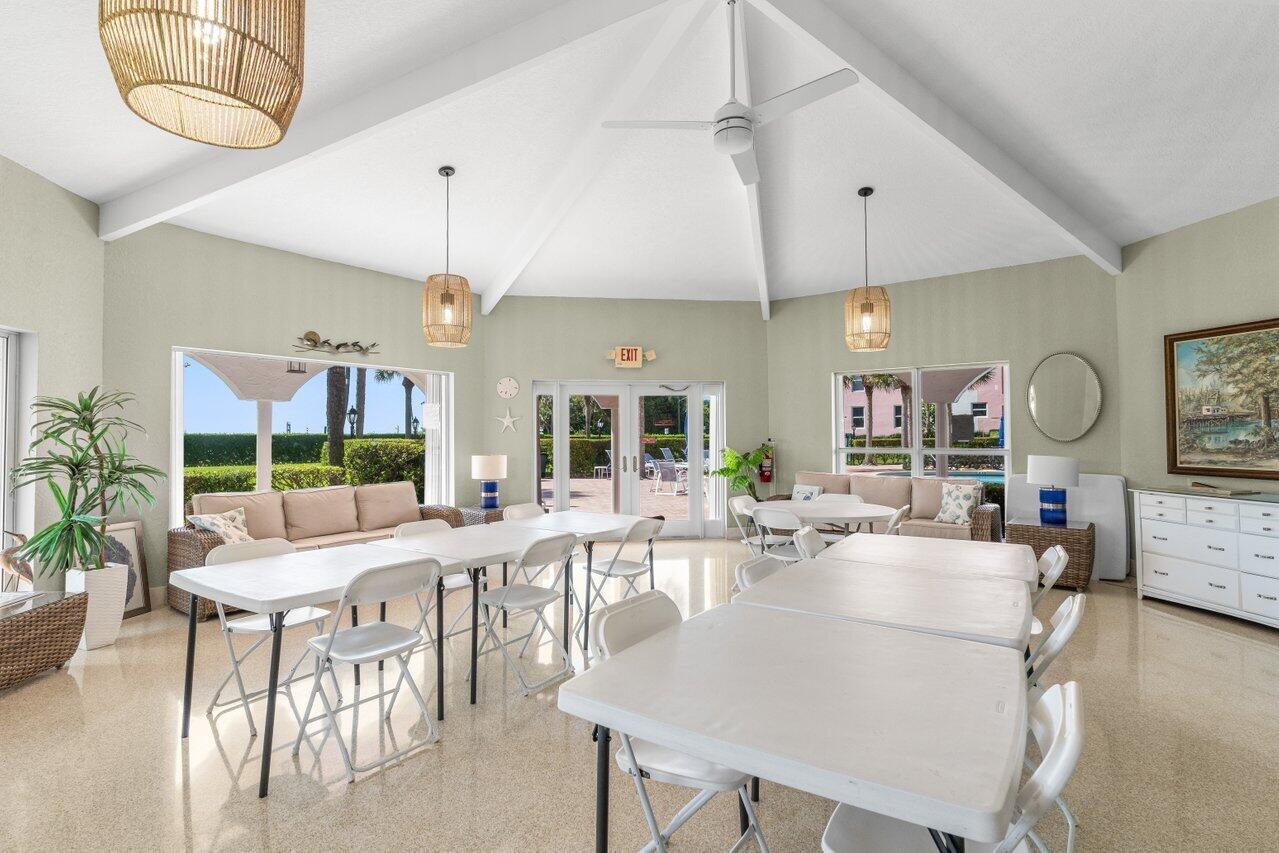 1040 Banyan Road, Unit 501C Boca Raton, FL 33432 - Photo 44 of 47 a living room with furniture a chandelier and a large window