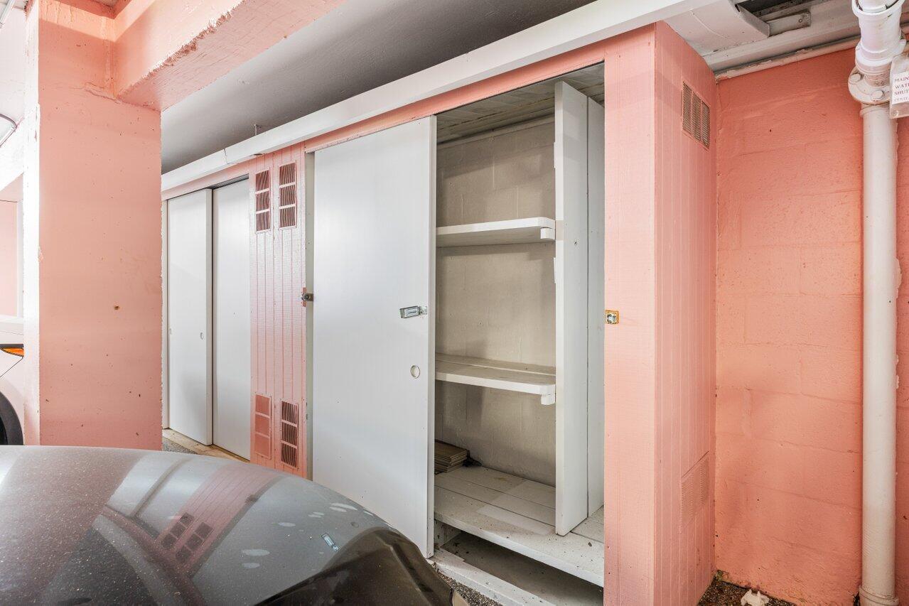 1040 Banyan Road, Unit 501C Boca Raton, FL 33432 - Photo 45 of 47 a room with a bed and glass door