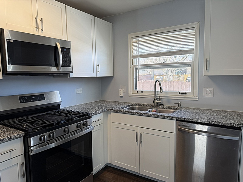 620 South 9th Avenue St. Charles, IL 60174 - Photo 11 of 30 a kitchen with granite countertop a sink and a stove top oven