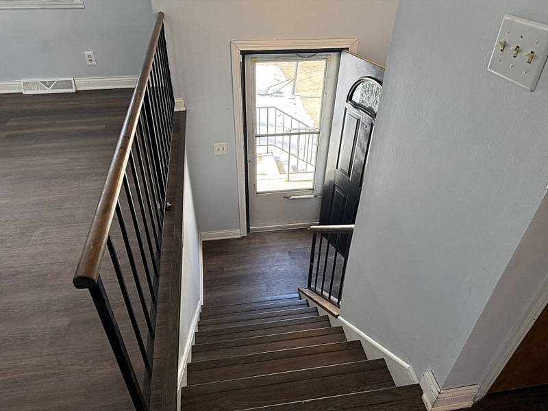 620 South 9th Avenue St. Charles, IL 60174 - Photo 18 of 30 a view of a hallway with wooden floor and stairs