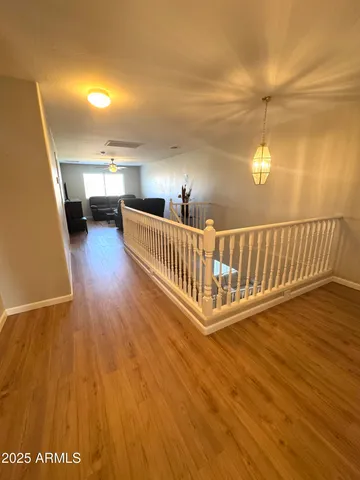 a view of a balcony with wooden floor