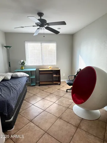 a bathroom with a granite countertop sink a toilet and a mirror