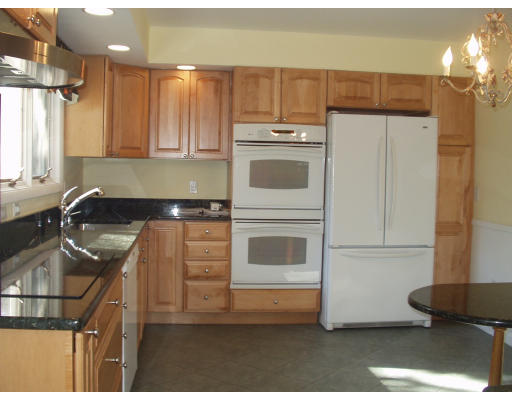 51 Sevinor Road Marblehead, MA 01945 - Photo 6 of 12 a kitchen with kitchen island a sink cabinets and window
