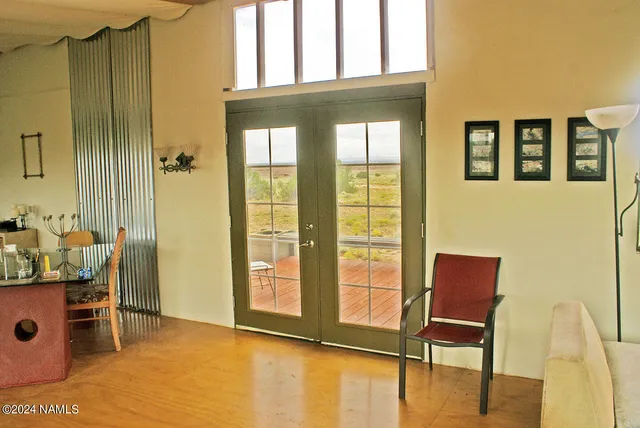 a view of a livingroom with furniture and windows