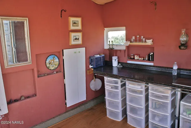 a kitchen with a sink and a refrigerator
