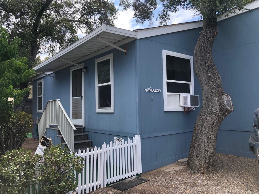 12306 Old Pomerado Road, Unit 14 Poway, CA 92064 - Photo 2 of 20 a front view of a house with a yard