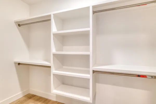 a close view of closet with wooden floor
