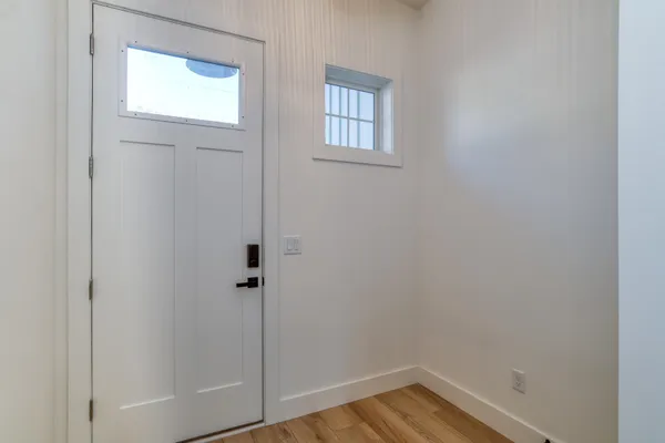 a view of a room with wooden floor and closet