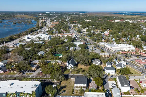 an aerial view of residential building and ocean