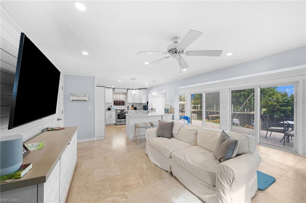 1360 Chesapeake Avenue Naples, FL 34102 - Photo 11 of 22 Living room featuring ceiling fan