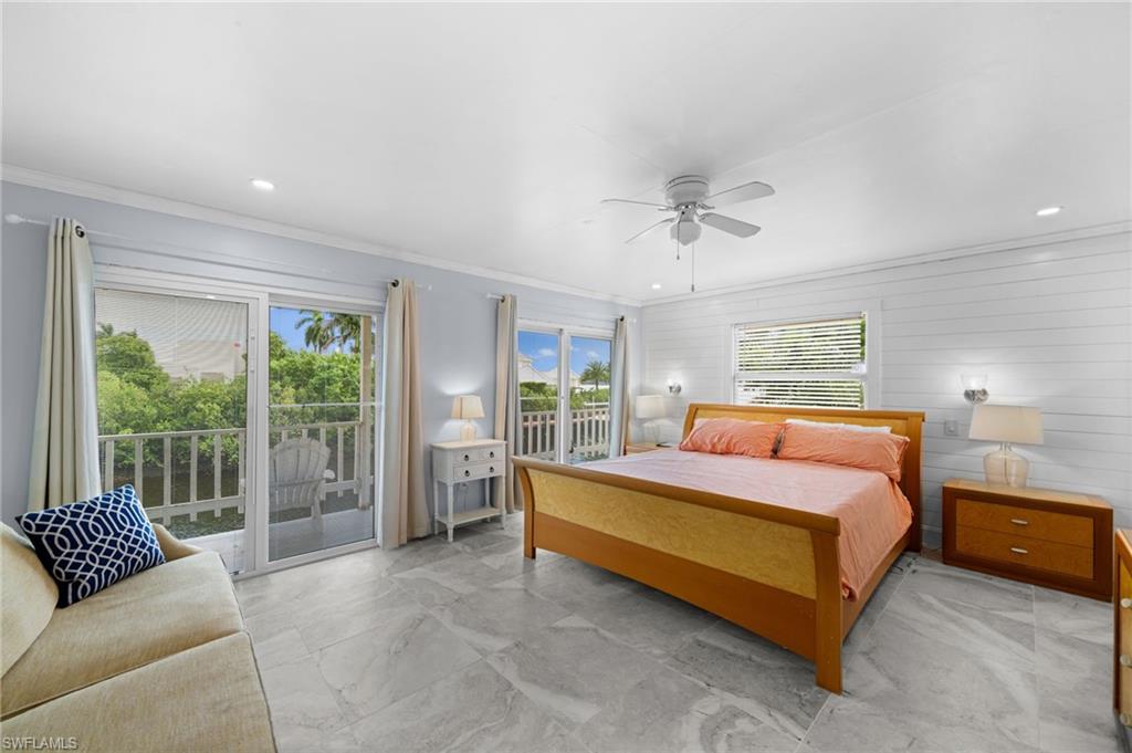 1360 Chesapeake Avenue Naples, FL 34102 - Photo 17 of 22 Bedroom with crown molding, access to exterior, multiple windows, and ceiling fan