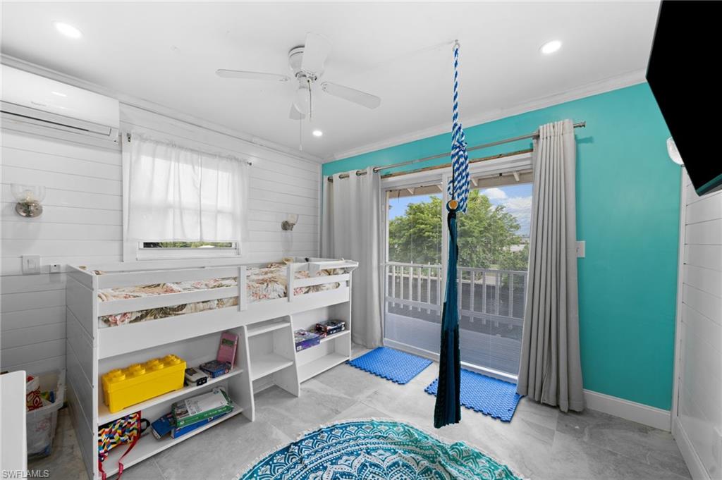1360 Chesapeake Avenue Naples, FL 34102 - Photo 19 of 22 Bedroom featuring crown molding, ceiling fan, a wall mounted air conditioner, and access to outside