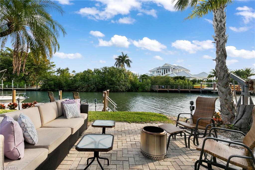 1360 Chesapeake Avenue Naples, FL 34102 - Photo 2 of 22 View of patio / terrace featuring a water view and an outdoor living space